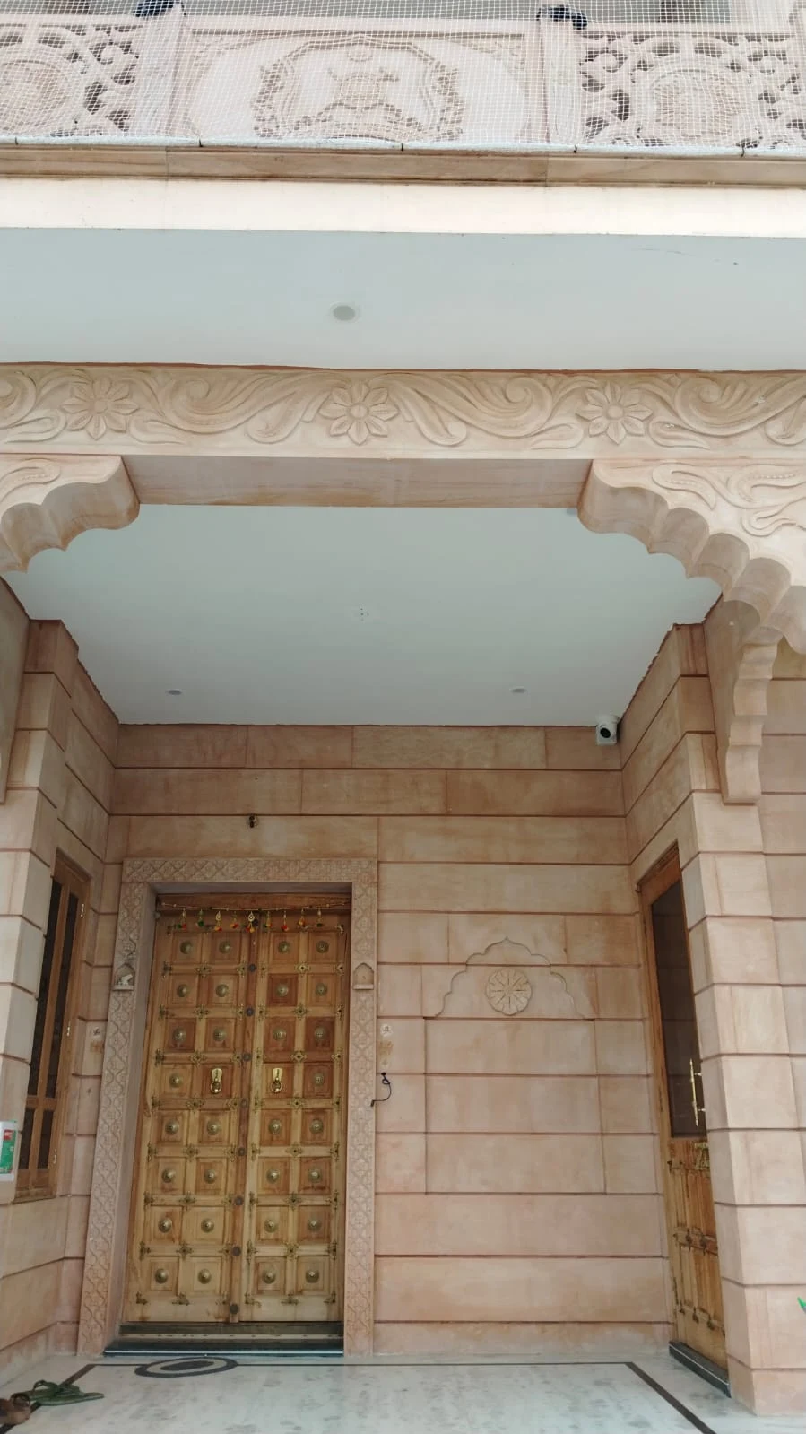 Ground-floor main entrance, viewed from outside toward the front door