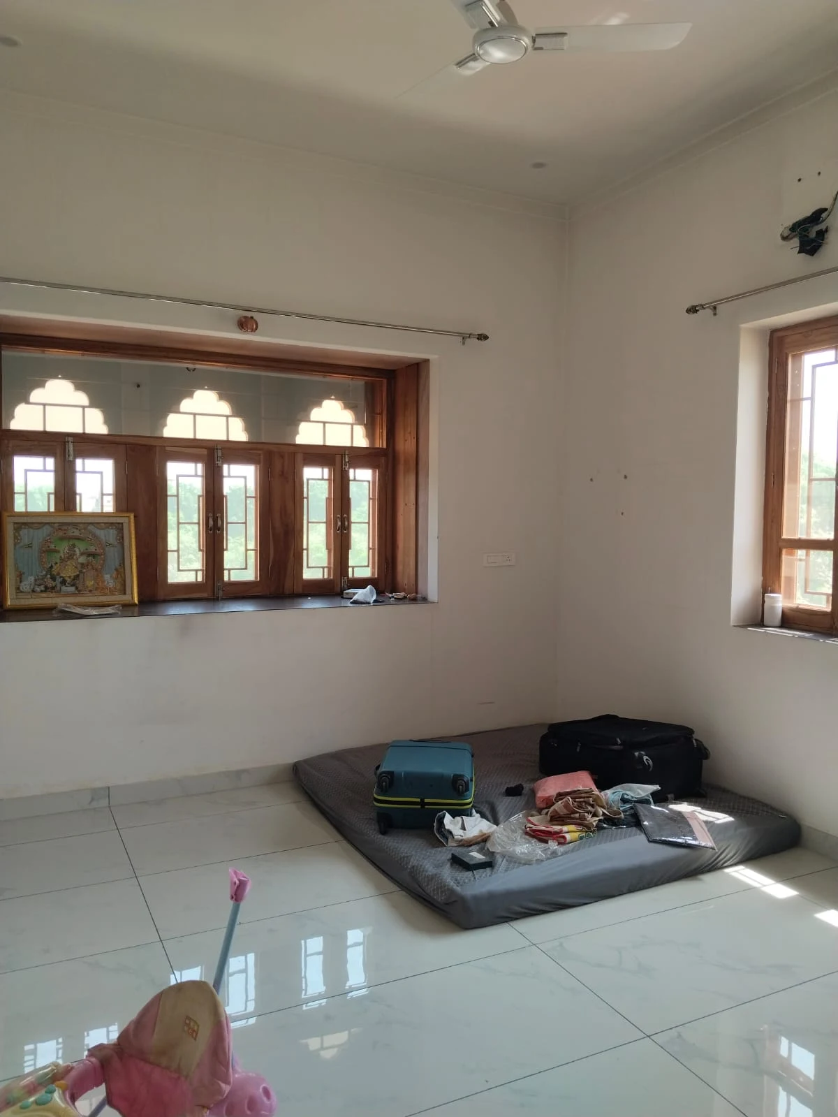 Front-side first-floor bedroom, viewed from the doorway toward the windows