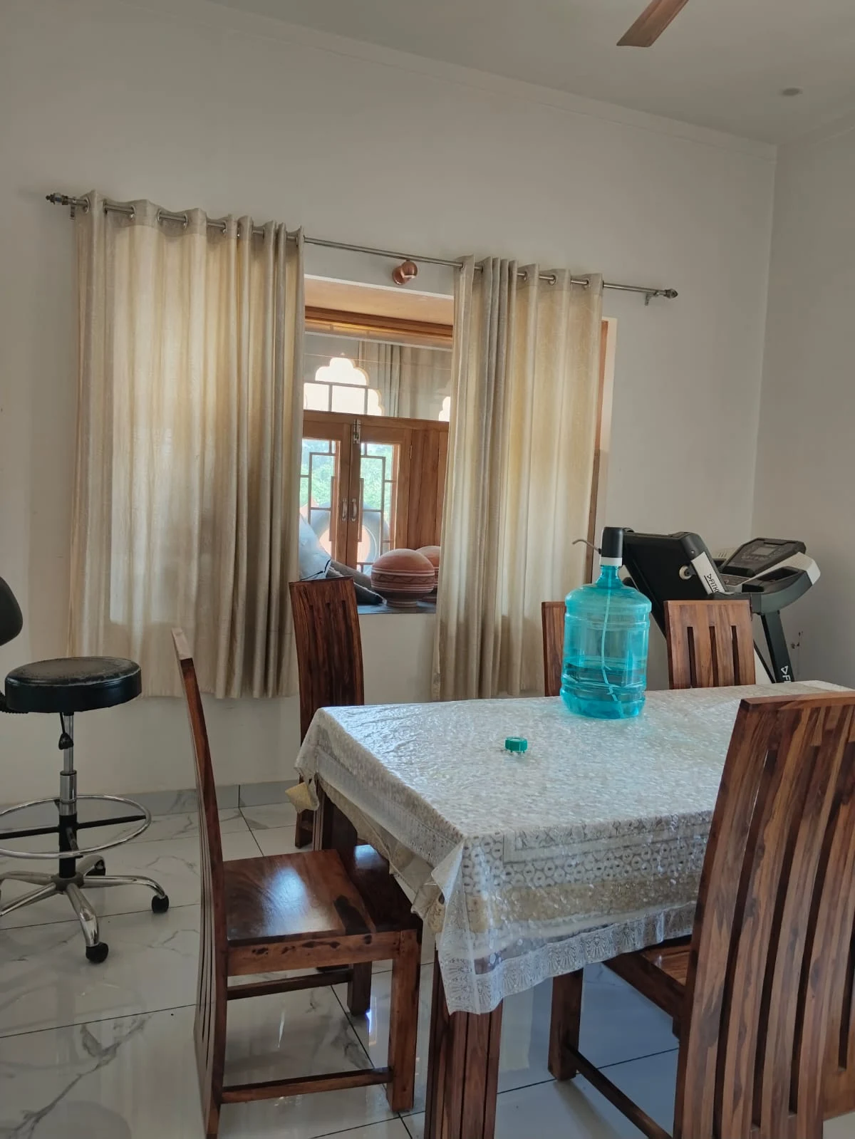 Ground-floor dining room, from the doorway toward the dining table and window